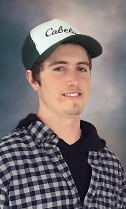 A Portrait of James Scissons. He is wearing a blue and white Cabela's ballcap.