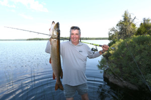 Patrick Campeau with fishing rod and big fish